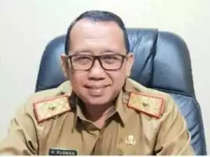 H. Rusman Kepala Dinas PMD Kabupaten OKU Timur, Bersama Kita Kawal Dana Desa Agar Tepat Sasaran